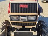 a tractor that is parked in a parking lot