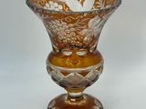 a glass vase that is sitting on a table