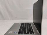 an open laptop computer sitting on top of a white table