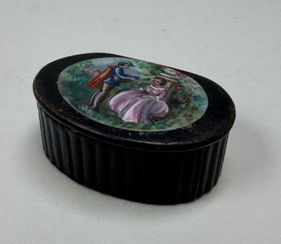a small black box with a picture of a bird on it