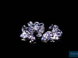 a close up of a group of diamonds on a black background