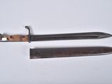 two knives that are laying on a white surface