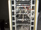 a rack with wires and wires in it in a room