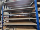 many shelves that are stacked up in a room