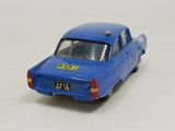 a blue toy car that is on a white surface