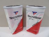 two cans of tecnifibre are sitting on a table