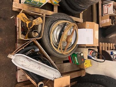 a pile of tires and other items on a pallet