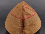a close up of a hat on a mannequin head on a table