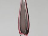 a black and pink glass vase on a white table