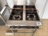 two burners on the stove in the kitchen
