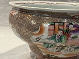 a vase that has a picture of a woman on it
