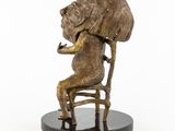 statue of a woman sitting on a chair with a hat on her head