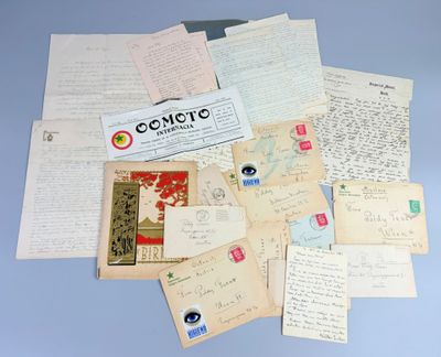 a pile of old letters and papers on a table