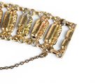 an image of a close up of a gold bracelet with a chain