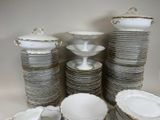 a lot of plates and bowls stacked on top of each other