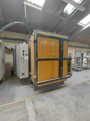 a large room with a refrigerator and other appliances in it