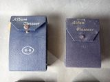 three small blue boxes that are sitting on a table