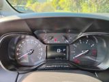 the dashboard of a car with a clock and gauges on it