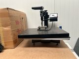a machine that is sitting on a table next to a box