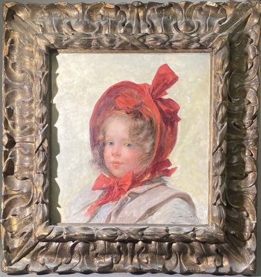 portrait d'une jeune fille coiffée d'un bonnet rouge, dans un cadre doré