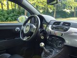 a car with a steering wheel and a dash board