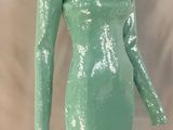 a green sequinized dress on a mannequin mannequin mannequin mannequin mannequin mannequin mannequin mannequin