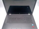 an open laptop computer sitting on top of a white table