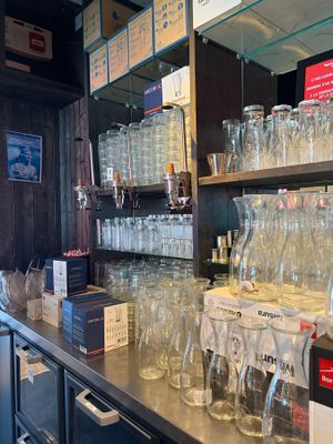 many empty glasses on the counter in the store