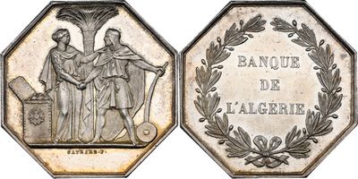 a close up of a coin with a picture of two people on it