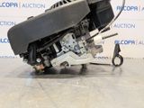 a close up of a motorcycle engine on a floor in a room