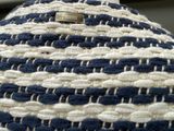 a close up of a blue and white hat with a tag on it