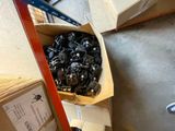 a cardboard box filled with lots of different types of screws