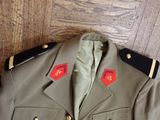 an image of a military uniform on a wooden floor