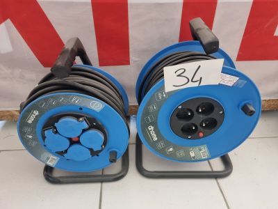 two blue hoses on the ground with a price tag on them