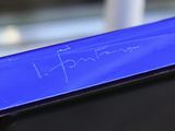 a close up view of a blue tablet with writing on it