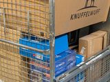 a cart with boxes and boxes in it on the street
