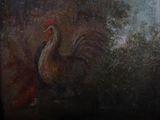 a painting of a rooster on the wall of a building