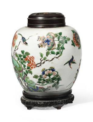 a white vase with flowers and birds painted on it
