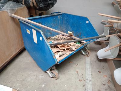 a blue cart that is sitting in the middle of a room