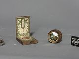 three miniature objects that are sitting on a table