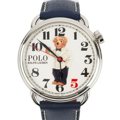 a close up of a watch with a teddy bear on the face