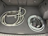a trunk of a car with a bunch of wires in it