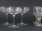 a group of wine glasses that are sitting on a table
