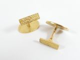 a close up of a pair of gold cufflinks on a white background