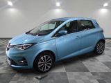 a blue car is parked in a room with a checkered floor