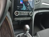a car dashboard with a digital device in it