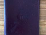 purple leather ipad case on wooden table with apple logo