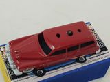 a red toy car sitting on top of a blue box