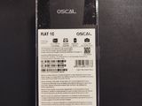 the back of a black cell phone with a white label on it