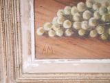 a painting of a bunch of grapes on a table